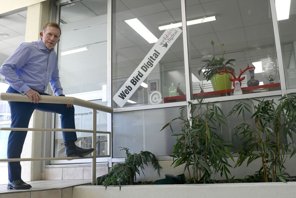 Alan outside the Web Bird Digital office in Miranda