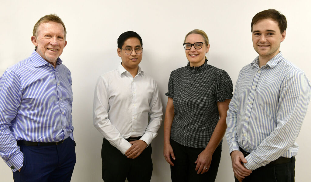 The Web Bird Digital team standing together in the office