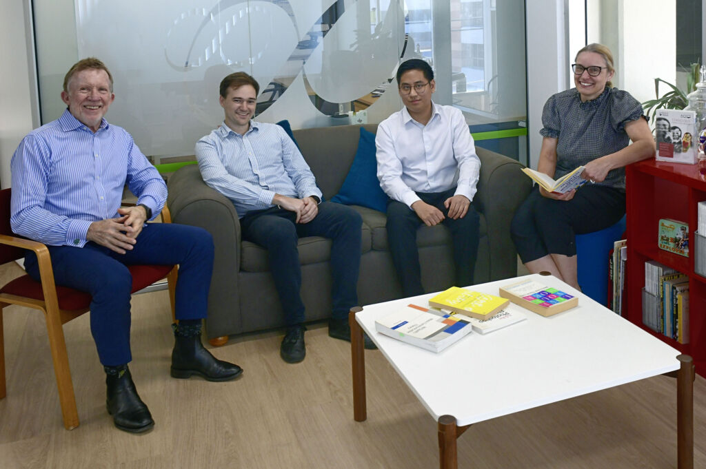 The Web Bird Digital team relaxing on the couches in the office lounge